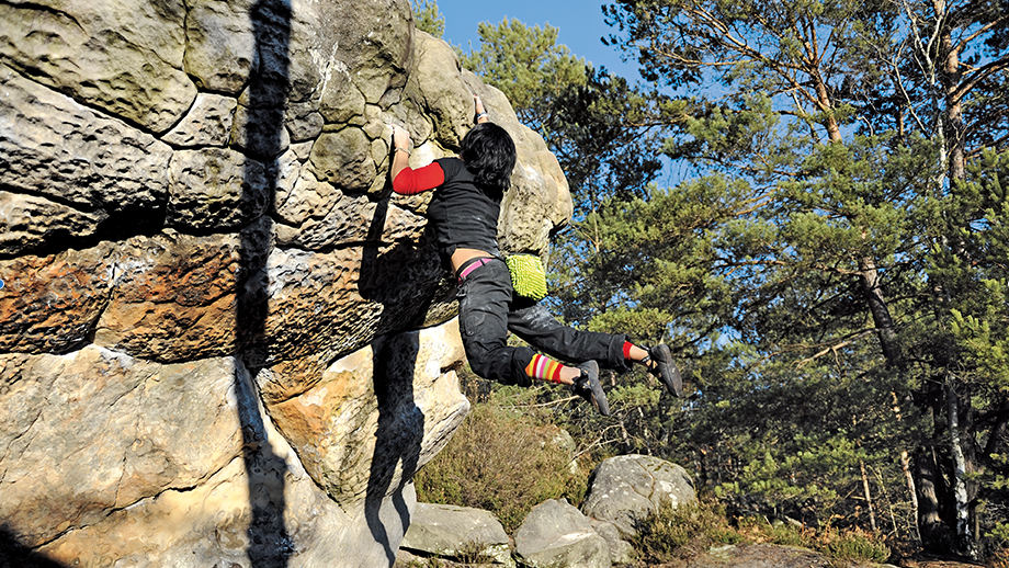 Nadia Montchaussé dynos on Le Surplomb ocre at Gorges d'Apremont, photo from Fontainebleau Climbs by Jacky Godoffe and Jo and Francoise Montchaussé 